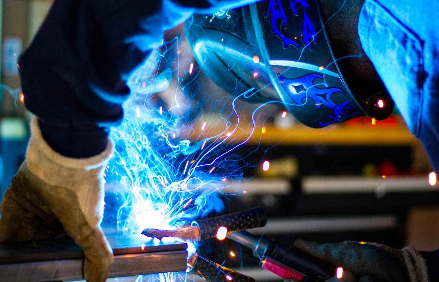 Fabricator welding on steel